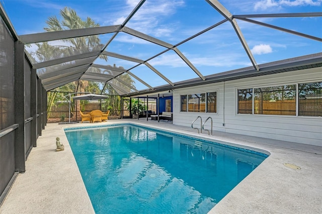 view of pool featuring a lanai and a patio