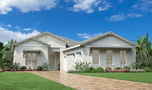 view of front of home with a front lawn and a garage