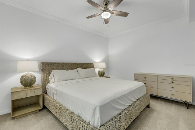 carpeted bedroom with ceiling fan and ornamental molding