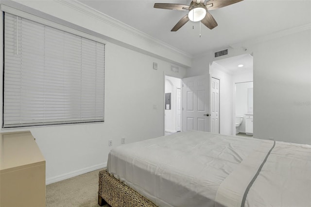 carpeted bedroom with ceiling fan, ensuite bathroom, and ornamental molding