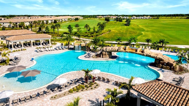 view of pool with pool water feature