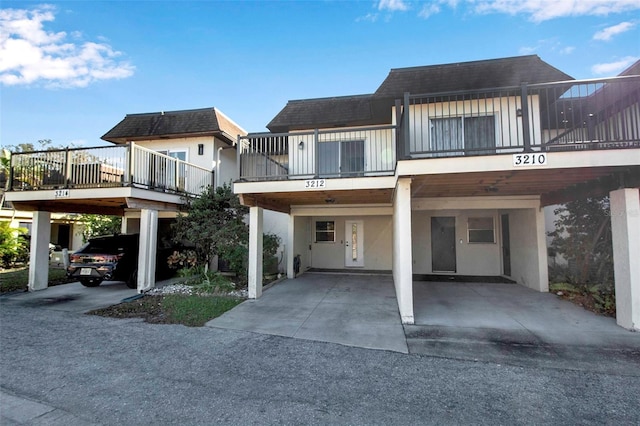 view of front of property featuring a carport