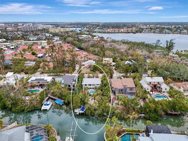 birds eye view of property with a water view