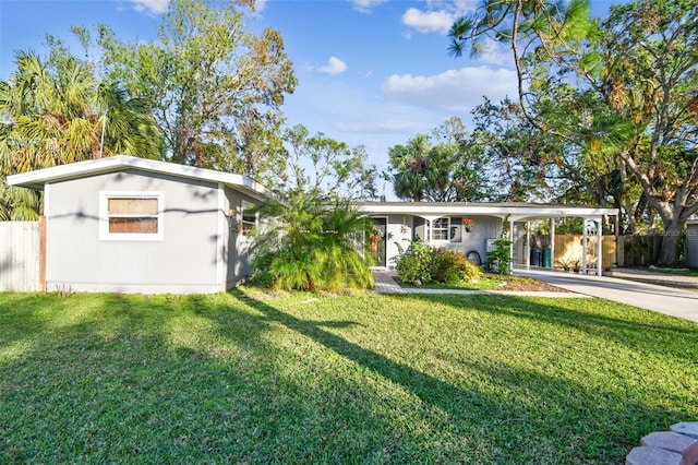 ranch-style house with a front yard and a carport