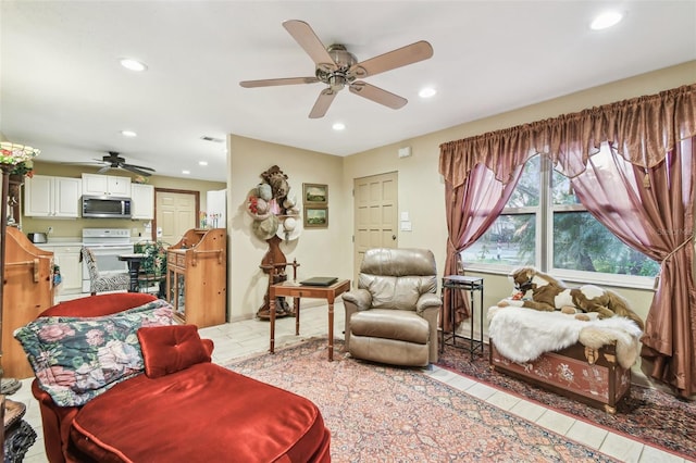 interior space with ceiling fan