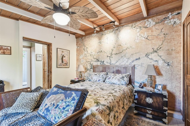 bedroom featuring beamed ceiling, ceiling fan, and wood ceiling