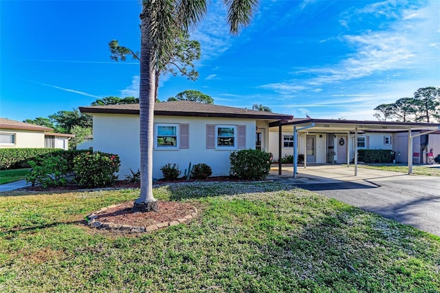 ranch-style home with a front lawn