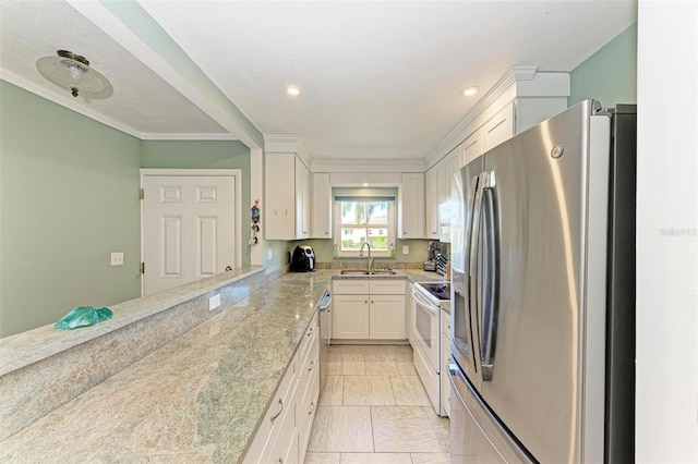 kitchen with white appliances, ornamental molding, light tile patterned floors, light stone counters, and white cabinetry