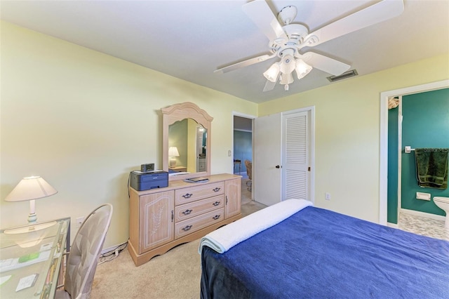 carpeted bedroom featuring ceiling fan and a closet