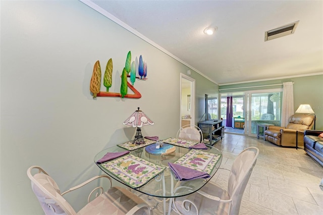 dining area featuring ornamental molding