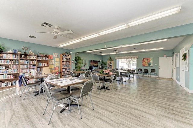 dining space featuring ceiling fan