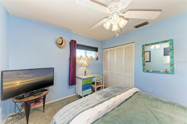 carpeted bedroom featuring a closet and ceiling fan