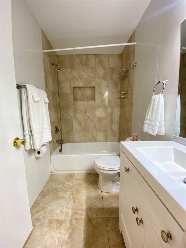 full bathroom with vanity, toilet, and tiled shower / bath combo