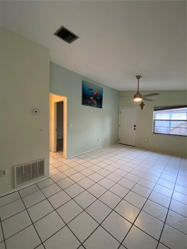 unfurnished room featuring light tile patterned floors and ceiling fan