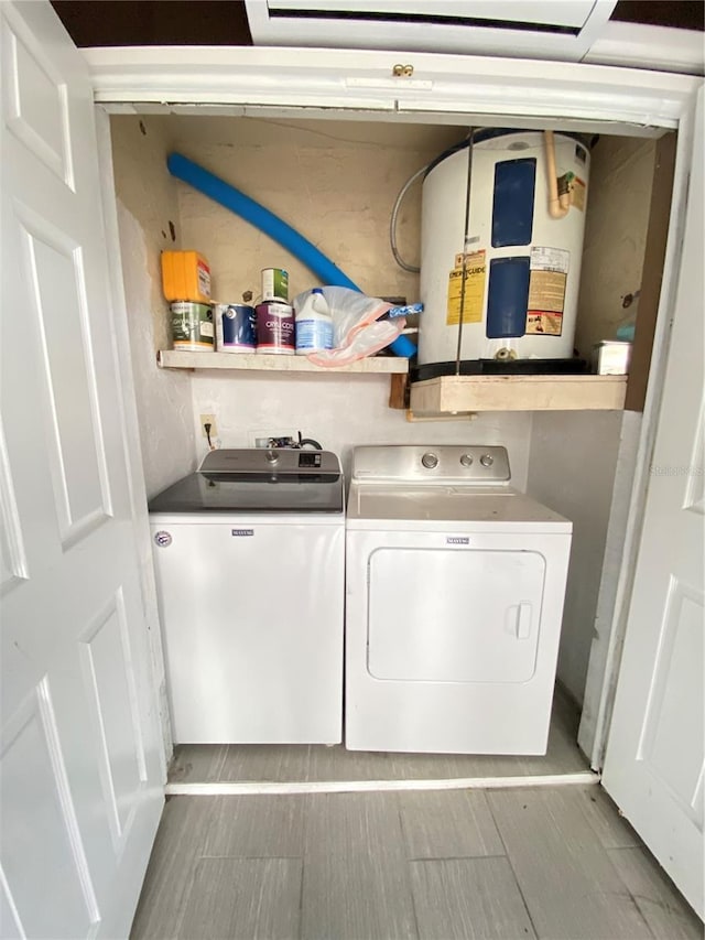 clothes washing area featuring independent washer and dryer