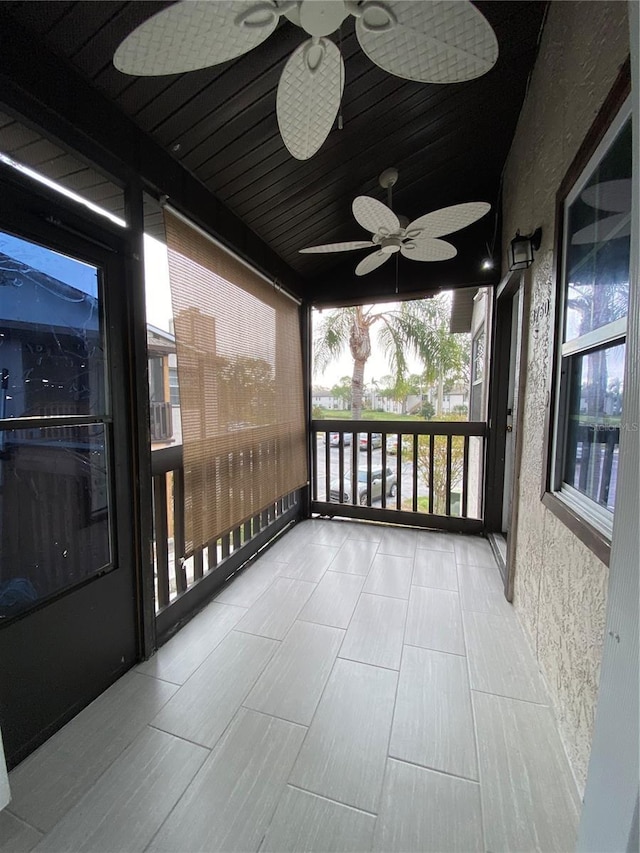 balcony featuring a porch and ceiling fan