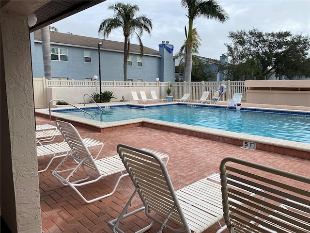 view of swimming pool featuring a patio area