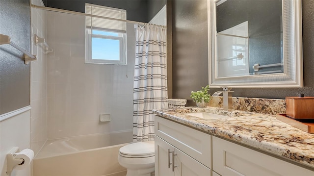 full bathroom with shower / tub combo with curtain, vanity, and toilet