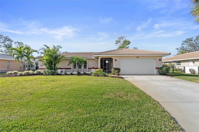 view of front of property featuring a garage and a front yard