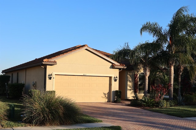 view of front of property with a garage