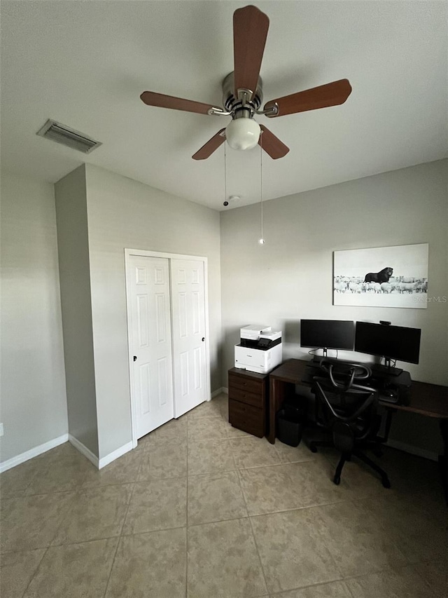 home office featuring ceiling fan and light tile patterned floors