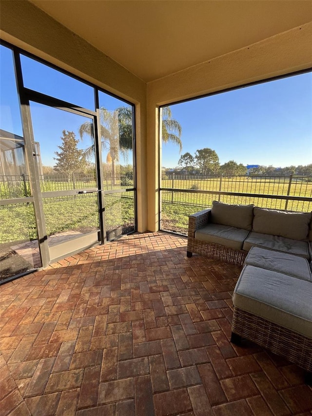 sunroom / solarium with a rural view