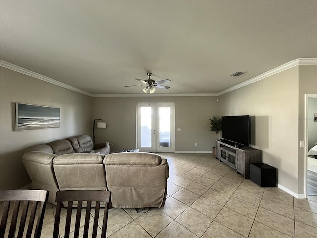 tiled living room with french doors, ceiling fan, and ornamental molding