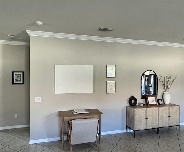 sitting room featuring tile patterned flooring and crown molding