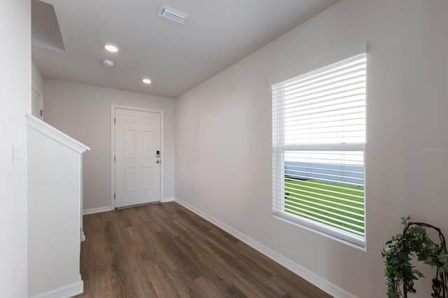 hallway with dark wood-type flooring