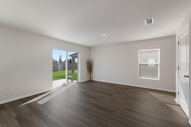 empty room featuring dark hardwood / wood-style floors