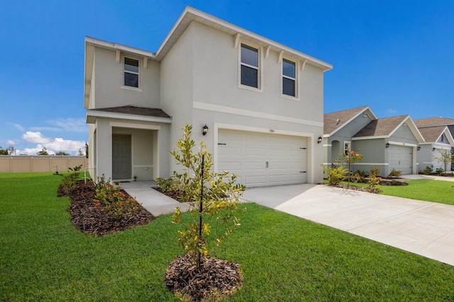 view of front of property featuring a garage and a front lawn