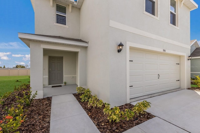 doorway to property with a garage