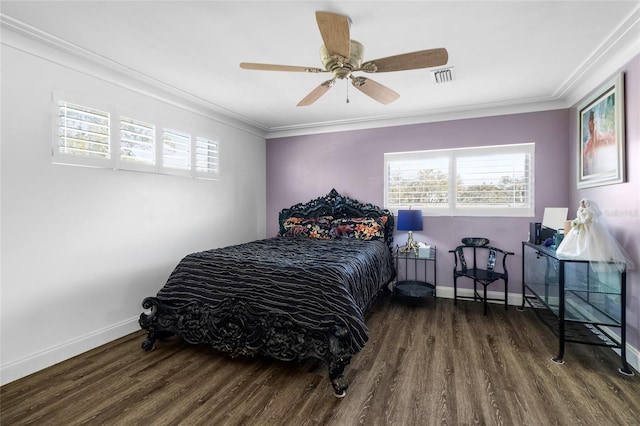 bedroom featuring ceiling fan, crown molding, and dark wood-type flooring