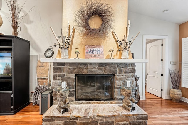 interior details featuring a fireplace and hardwood / wood-style floors