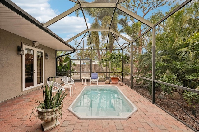 view of pool featuring a lanai, french doors, and a patio