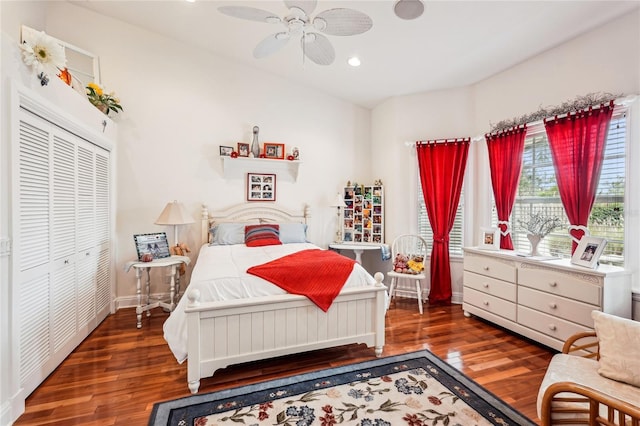 bedroom featuring ceiling fan, a closet, and dark hardwood / wood-style flooring