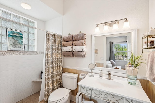 bathroom featuring sink, toilet, and walk in shower