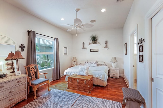 bedroom with ceiling fan and hardwood / wood-style flooring