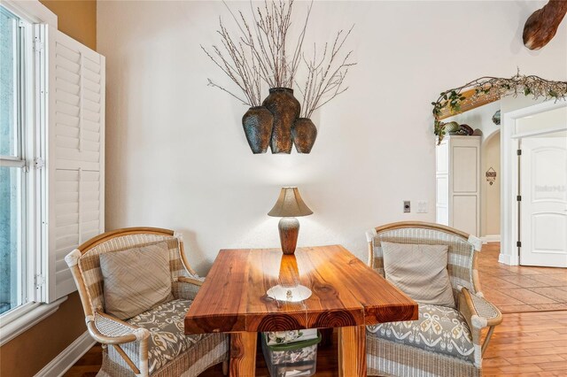 sitting room featuring a wealth of natural light and light hardwood / wood-style flooring