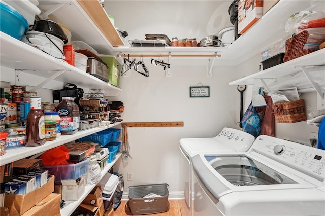 laundry area featuring washing machine and clothes dryer