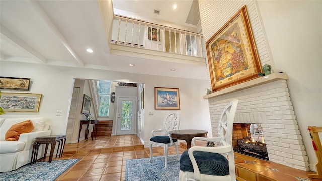 sitting room featuring a fireplace and tile patterned flooring