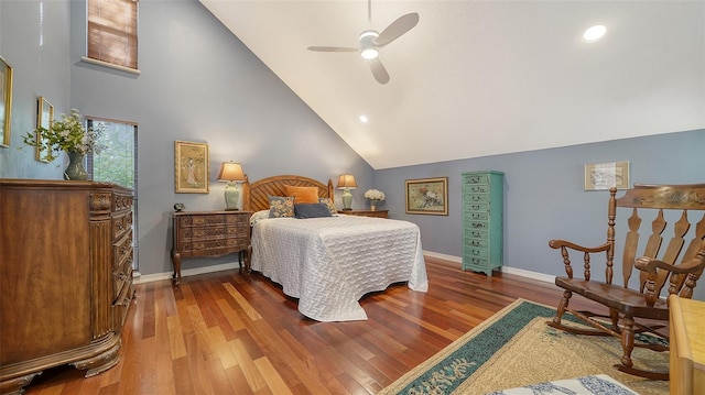 bedroom featuring hardwood / wood-style flooring, ceiling fan, and high vaulted ceiling