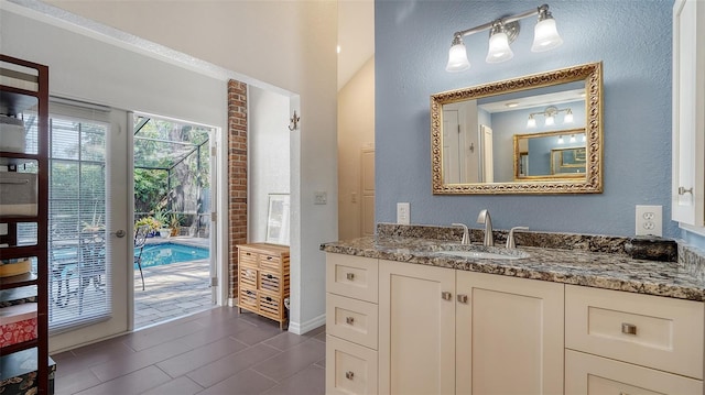 bathroom with tile patterned flooring and vanity