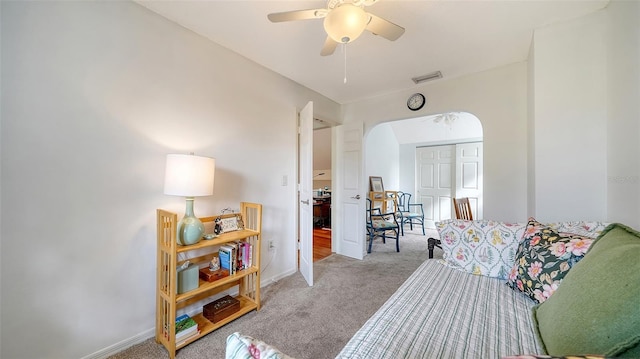 carpeted bedroom with ceiling fan