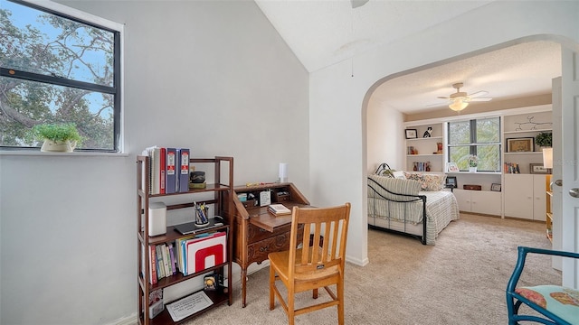 bedroom with light carpet, a textured ceiling, and ceiling fan