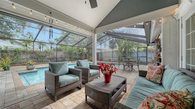 view of patio featuring outdoor lounge area, a lanai, and a fenced in pool