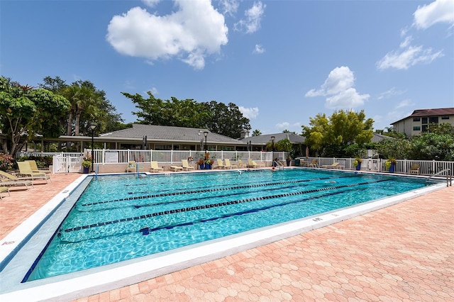 view of swimming pool featuring a patio area