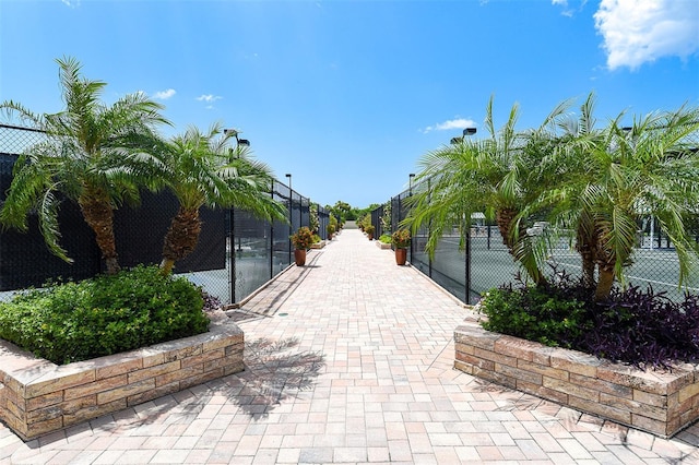 surrounding community featuring tennis court