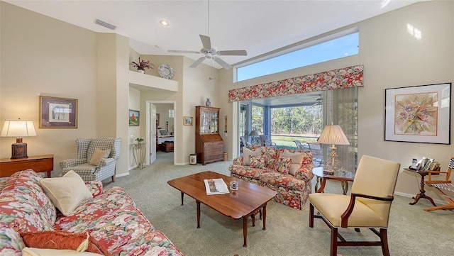 carpeted living room featuring a high ceiling and ceiling fan