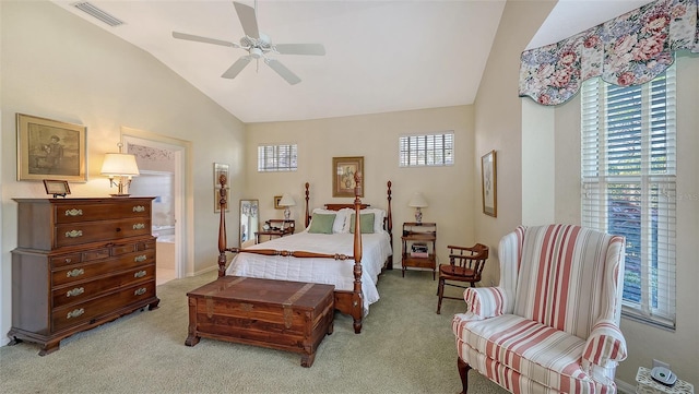 bedroom with ceiling fan, light carpet, and vaulted ceiling